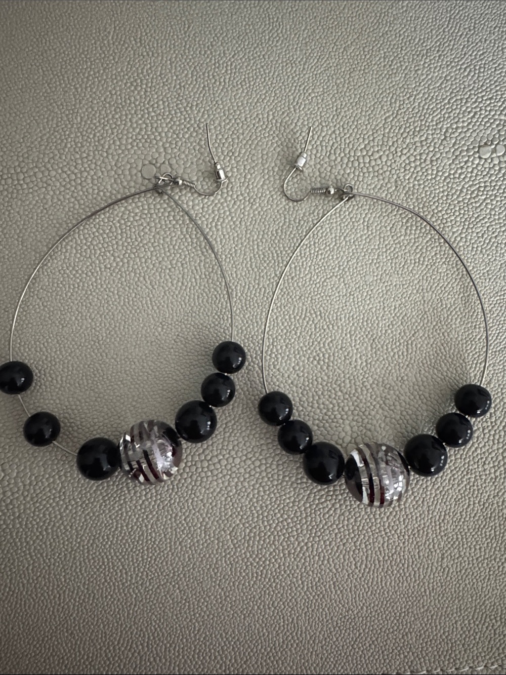 Silver Hoop Earrings with Black Beads and Striped Accent Bead